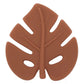 A silicone teether in the shape of a leaf, primarily in rust color.