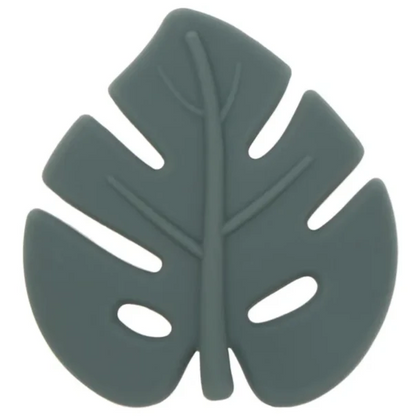 A silicone teether in the shape of a leaf, primarily in green color.